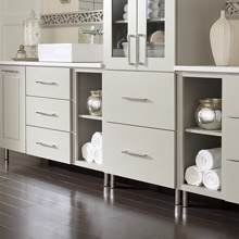 Light gray bathroom cabinets with metal feet