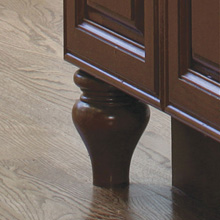 Close up of dark wood cabinets with tulip foot