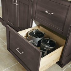 Two drawer base cabinet with bottom drawer open to show pots and pans storage