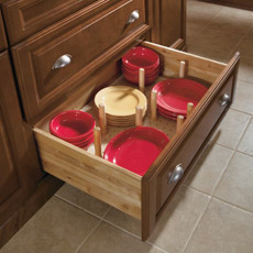 Cabinet drawer with pegged dish organizer
