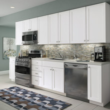 Aristokraft stock kitchen cabinets in white laminate