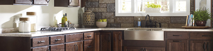 Close-up of kitchen cabinets in a dark wood stain