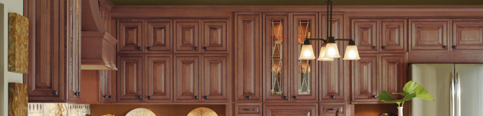 Medium tone wall cabinets in a kitchen