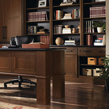 Home office with Cherry cabinets and open shelving