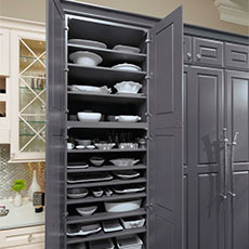 Tall kitchen cabinet open to show storage shelves