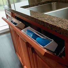 Sink base cabinet with tilt-outs opened