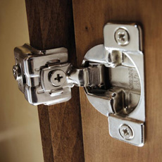 Close up of concealed hinge inside a cabinet