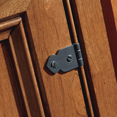Close up of a faux hinge on a cabinet door