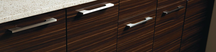 Close up of woodgrain thermofoil cabinets with contemporary pulls
