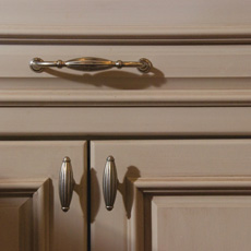 Close up of cabinet with traditional style pull and knobs