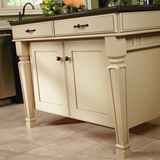Close up of painted kitchen island with cabinet legs