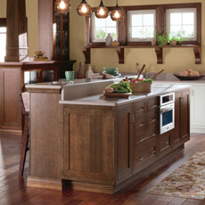 Kitchen island with built in oven cabinet and bar seating