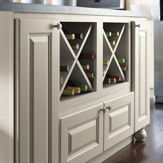 Close up of kitchen island with wine storage cabinets