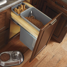Wastebasket cabinet re-purposed for storing dog food and treats