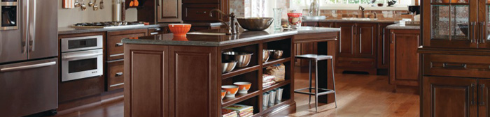 Dark Cherry kitchen with island featuring open shelving and seating