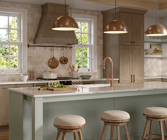 neutral kitchen painted in light brown with light blue kitchen island