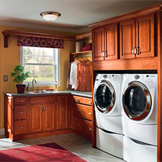 Give your laundry room cabinets a finished look by framing the washer and dryer with cabinetry. 