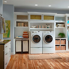 Our laundry bin storage cabinets keep supplies handy but out of sight. 