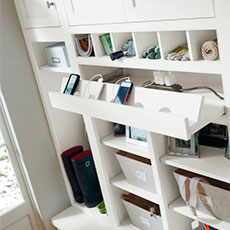 Function and convenience are designed into MasterBrand's office cabinetry, like this charging station cabinet accessory.