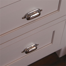 Cabinet with cup pulls in chrome finish